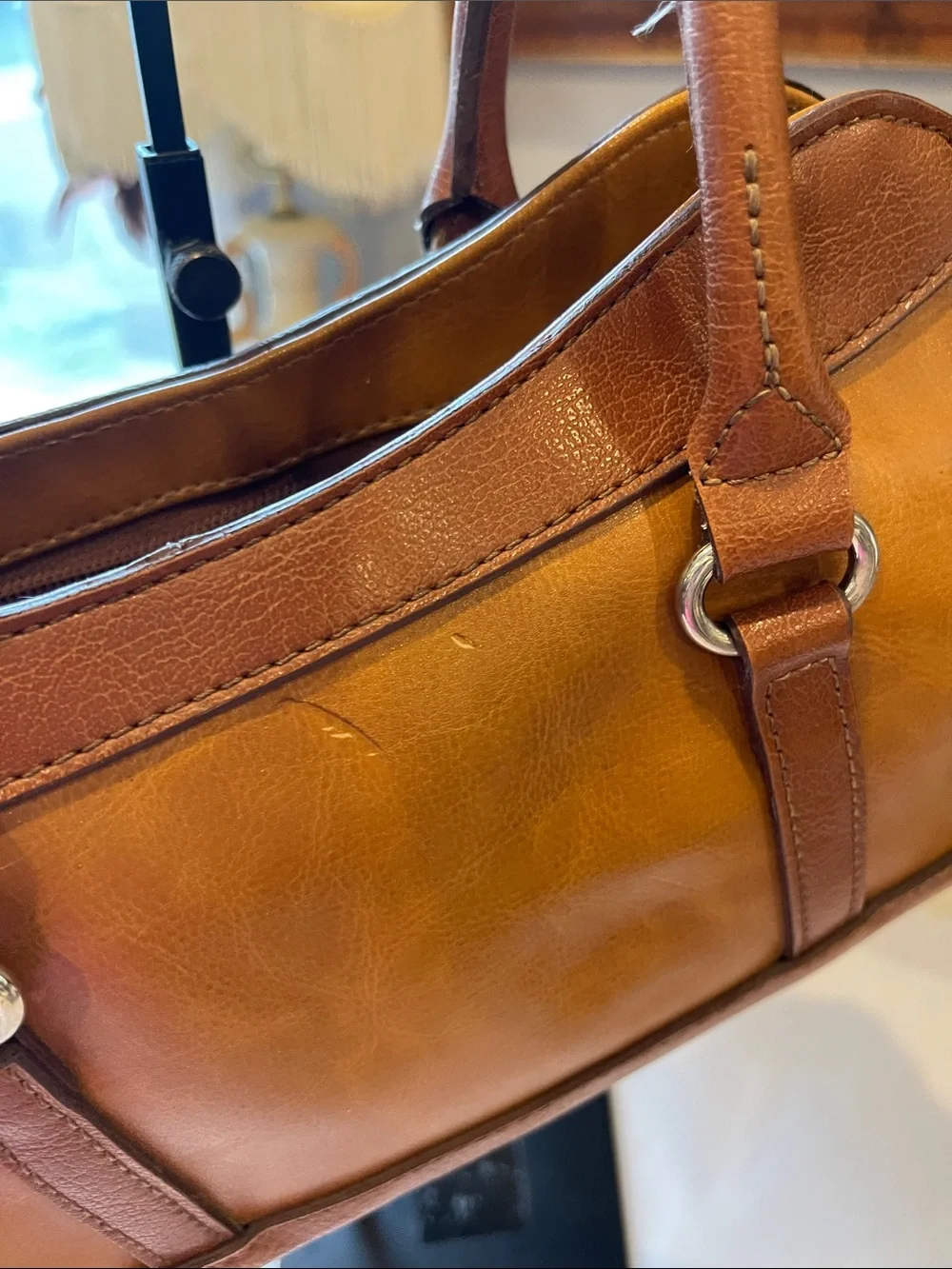 Rina Rich Brown and Tan Leather and vinyl Handbag Label View